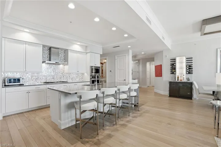 The SPECTACULAR kitchen is where guests naturally gather; this home’s design invites connection.