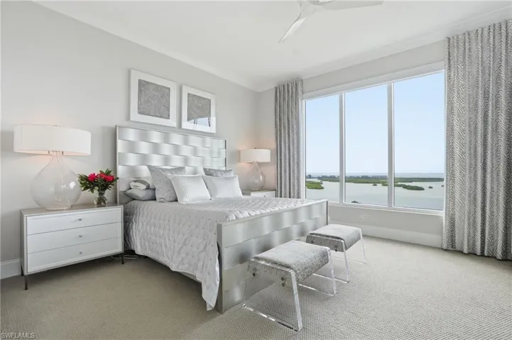 Elegantly appointed primary suite overlooking the bay and the gulf beyond.