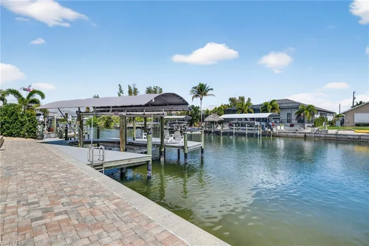Dock with a water view and boat lift