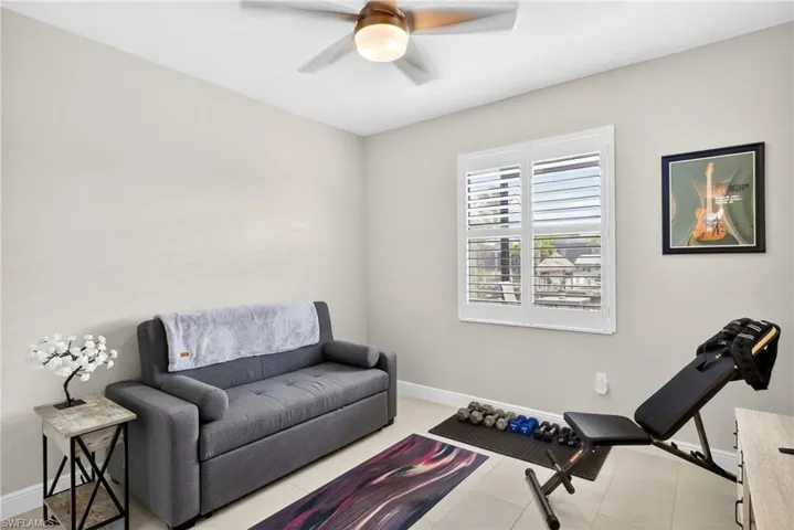 3rd bedroom currently utilized as an exercise room- overlooks the pool and canal.