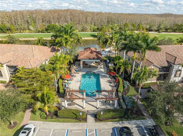 Drone / aerial view of a local golf course and a nearby body of water