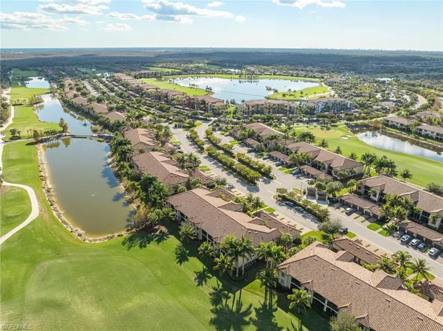 Aerial overview of property's location with a local golf course and nearby suburban area