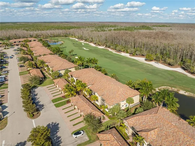 Aerial view of a golf club and a nearby body of water
