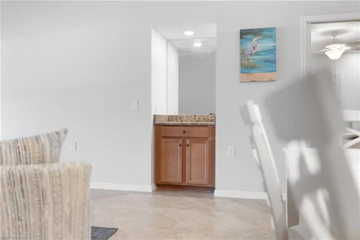 Bathroom with vanity, recessed lighting, and a ceiling fan