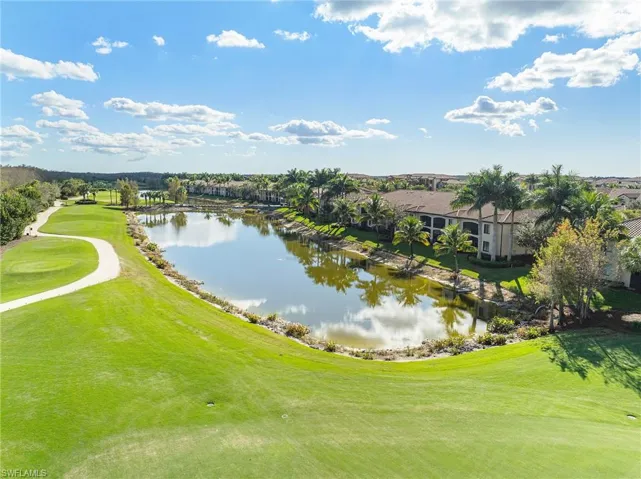 Water view with a golf course