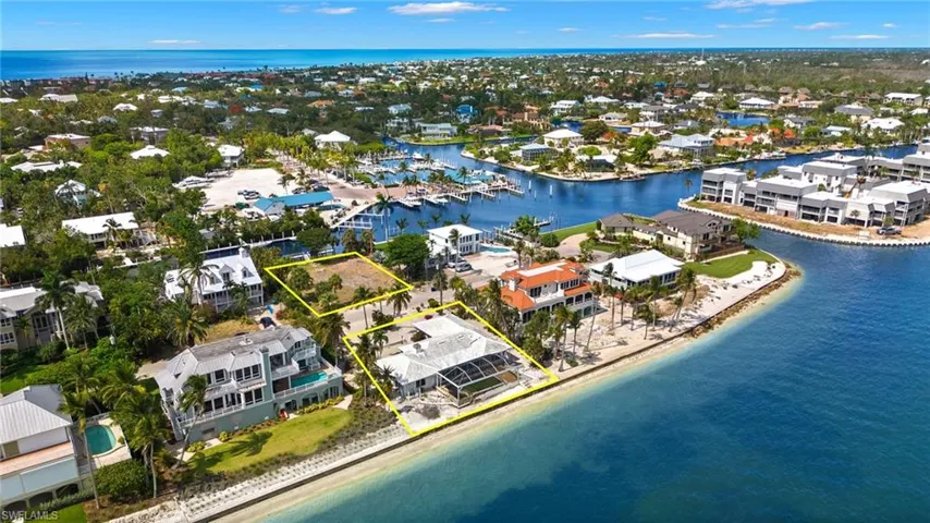 Drone / aerial view with a view of the beach and a water view