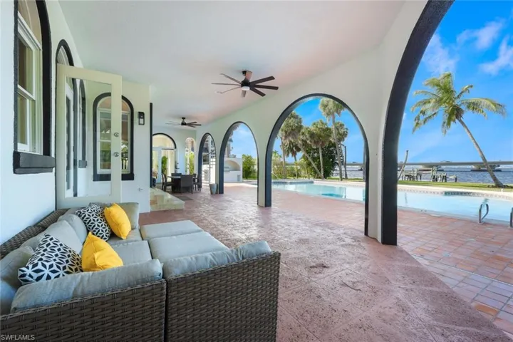 View of patio with an outdoor living space and ceiling fan
