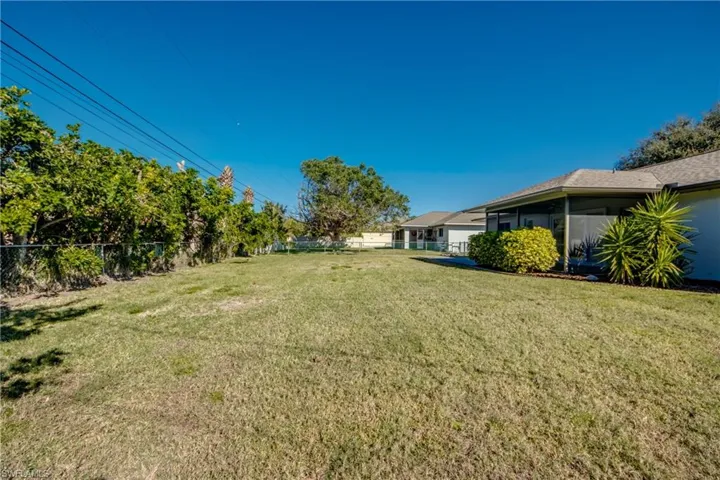 View of yard with a sunroom