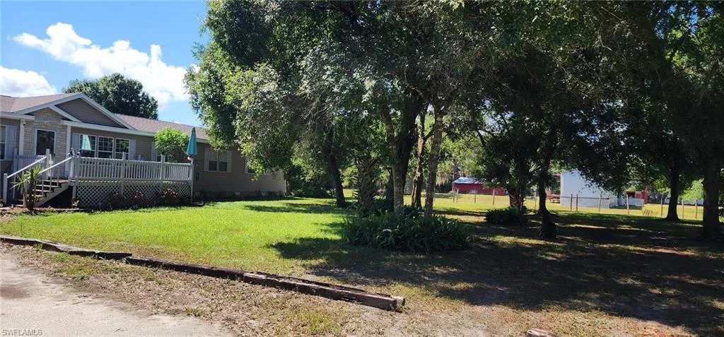 View of yard featuring fence
