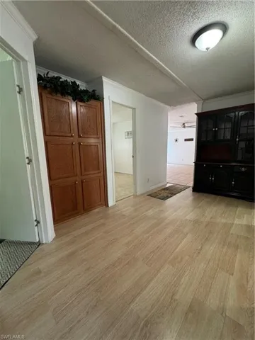 Hallway between 3 bedrooms and second bathroom