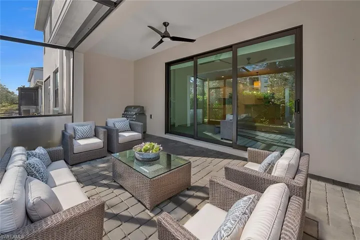 The screened in patio has been virtually staged