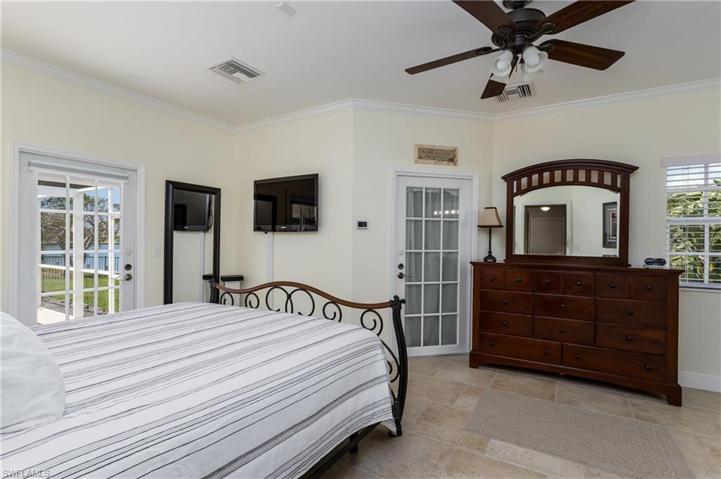 PRIMARY BEDROOM HAS CEILING FAN AND 2 WALK-IN CLOSETS