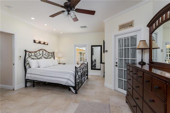 PRIMARY BEDROOM WITH DOOR TO LANAI