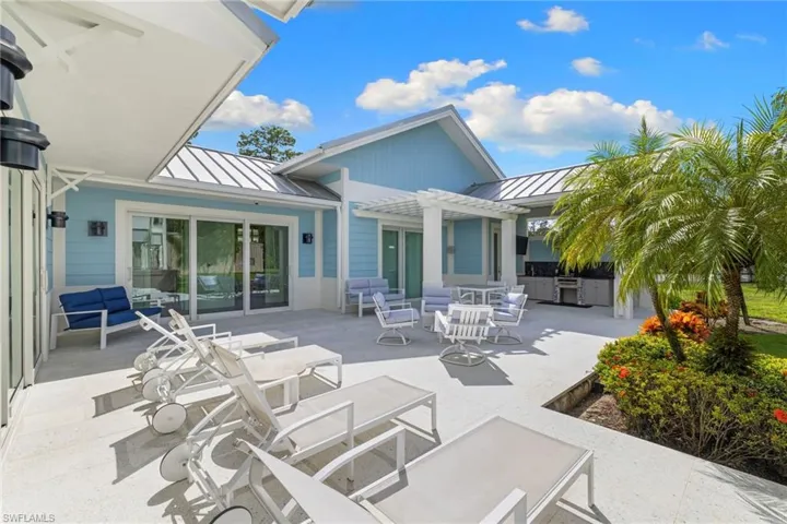 View of patio with outdoor dining space, an outdoor living space, and a pergola