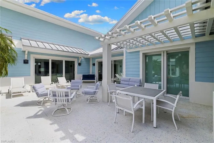 View of patio / terrace with a hot tub