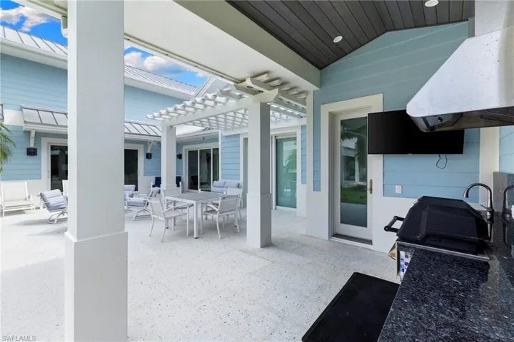 View of patio featuring a hot tub