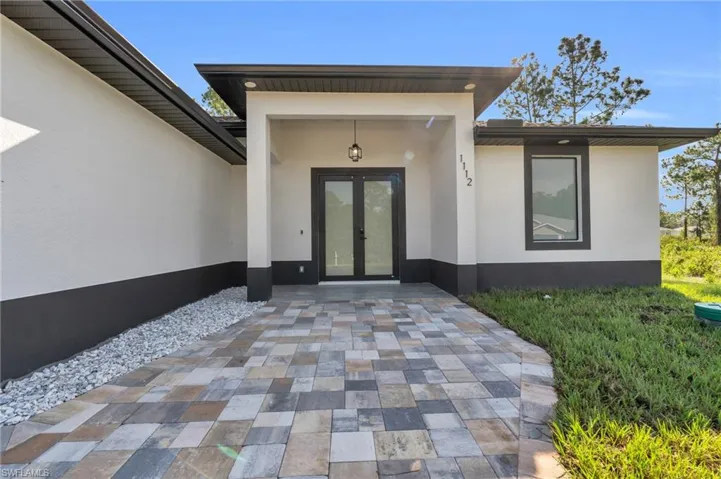Entrance to property featuring french doors
