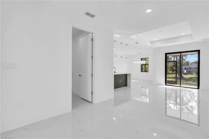 Spare room with a tray ceiling