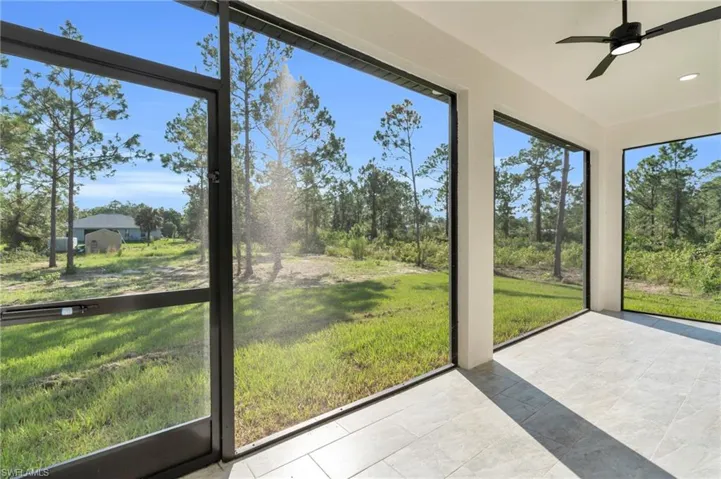 Sunroom featuring ceiling fan