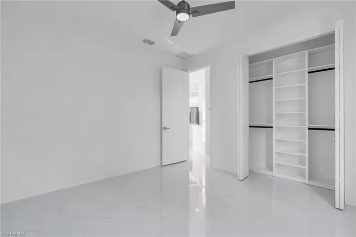 Unfurnished bedroom featuring a closet and ceiling fan