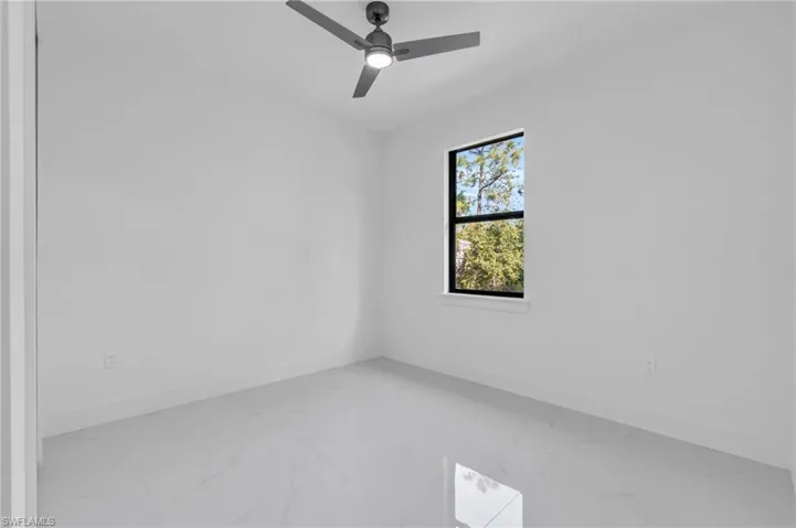 Spare room featuring ceiling fan