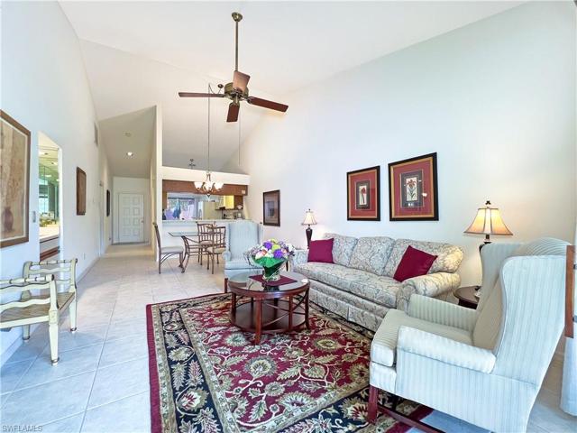 Living room looking to the front door and kitchen