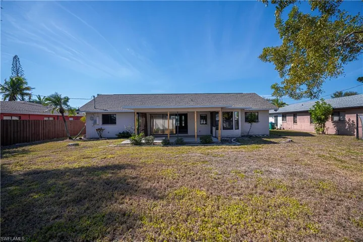 Ranch-style house featuring stucco siding