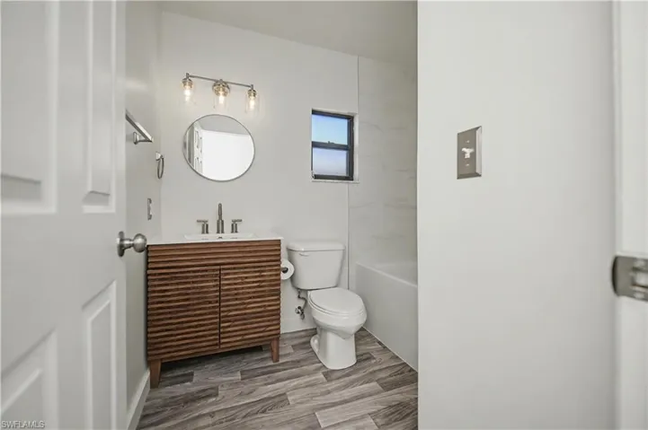 Full bathroom featuring vanity and light wood finished floors