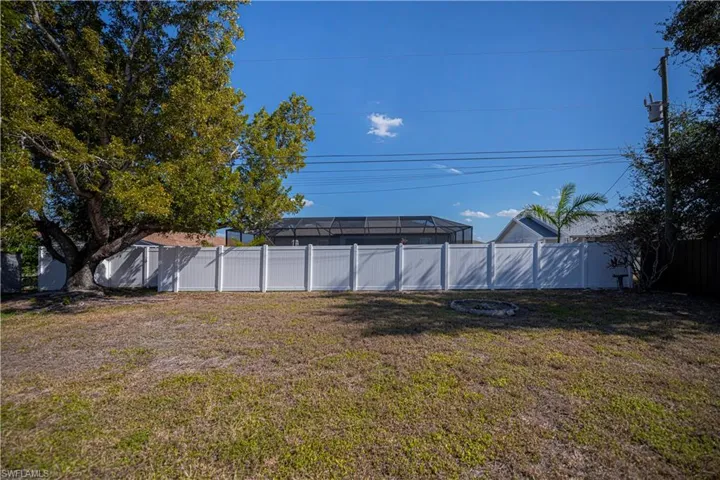 View of fenced backyard