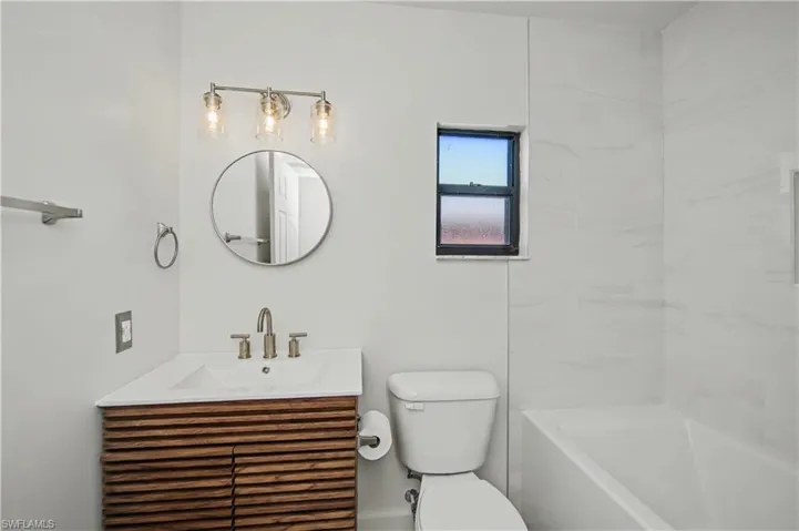 Full bathroom featuring vanity and shower / tub combination