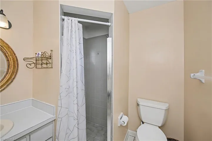 Full bathroom featuring a stall shower and vanity
