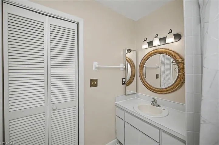 Full bathroom featuring vanity and a shower with curtain