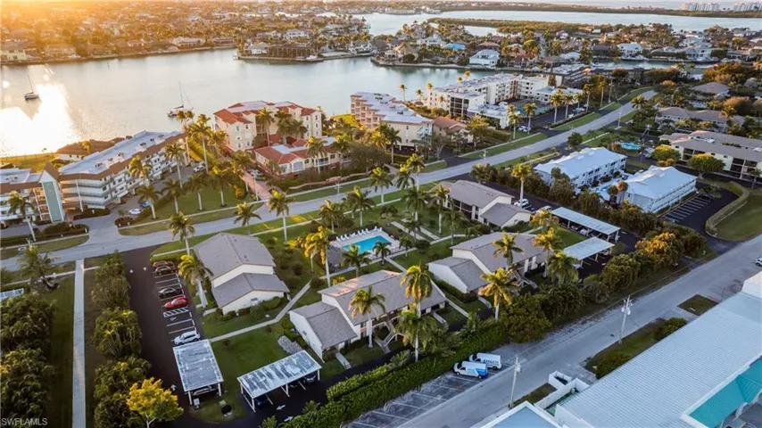 Bird's eye view of a nearby body of water and apartment complex