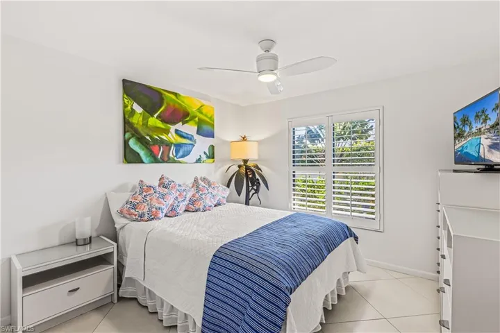 Bedroom featuring ceiling fan and light tile patterned flooring
