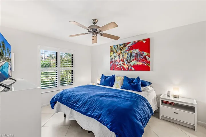 Bedroom featuring a ceiling fan and light tile patterned floors