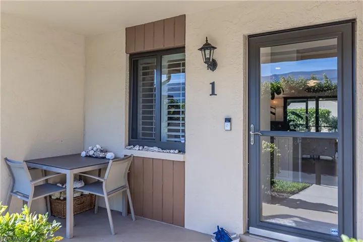 Property entrance with stucco siding