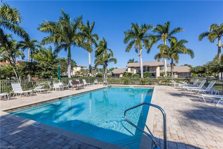 Community pool with a patio area