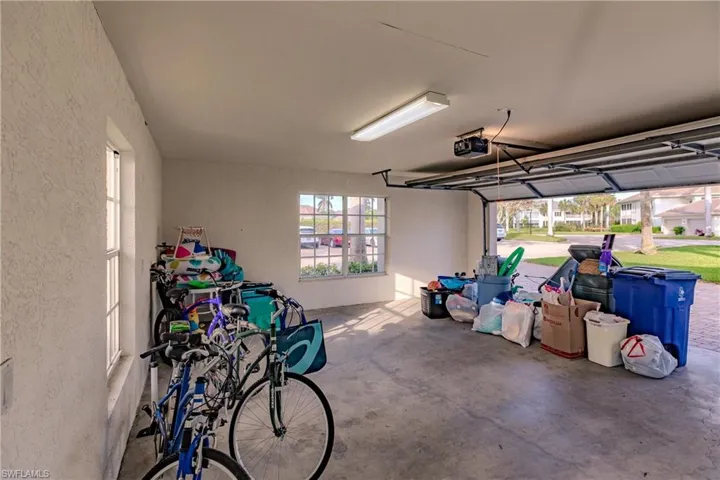 Garage featuring a garage door opener