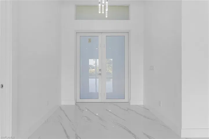 Property entrance with stucco siding