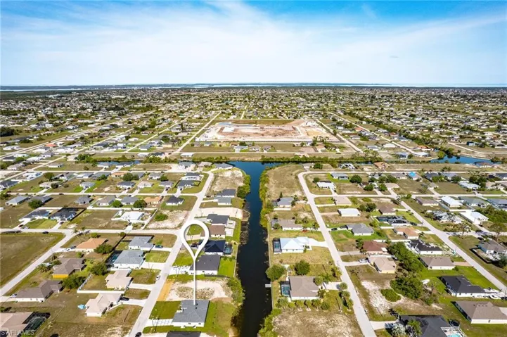 View of property location with nearby suburban area and a large body of water
