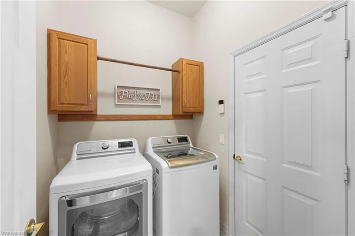 Laundry room with cabinet space and separate washer and dryer