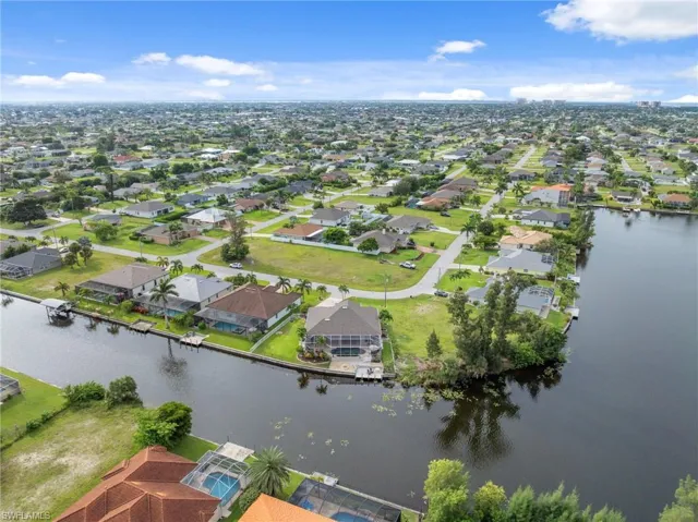 Aerial view of residential area with a large body of water