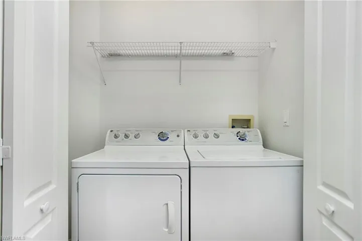 Laundry room with washing machine and dryer