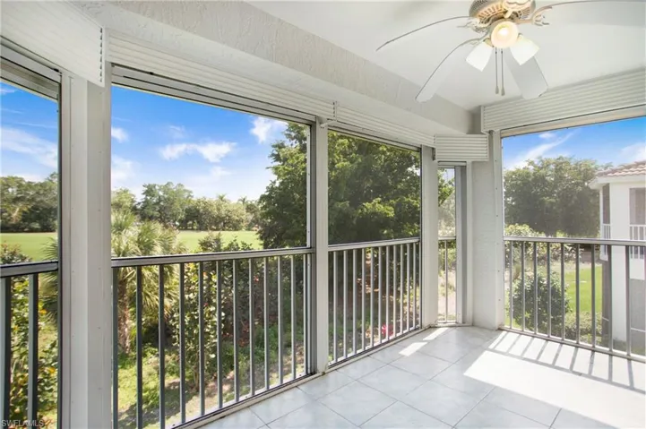 Unfurnished sunroom featuring tile patterned flooring