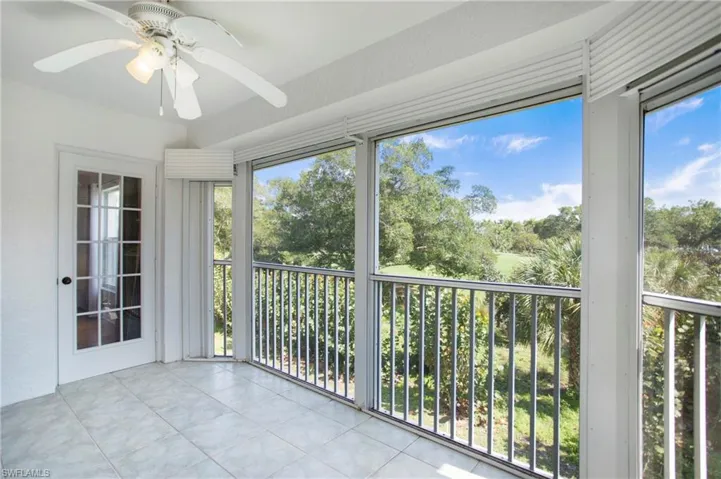 Unfurnished sunroom with tile patterned flooring