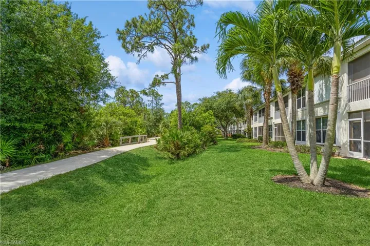 View of property's community with a yard