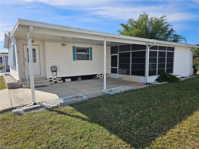 Side of the home with the carport