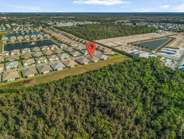 View of property location with nearby suburban area and a large body of water