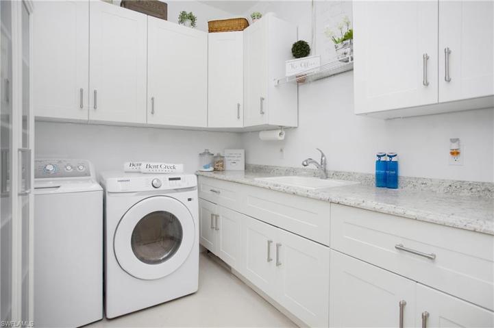 Laundry Room with cabinets and sink