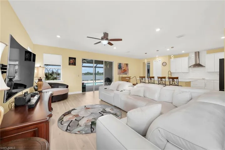 Open-concept interior featuring wood-finish flooring and a ceiling fan